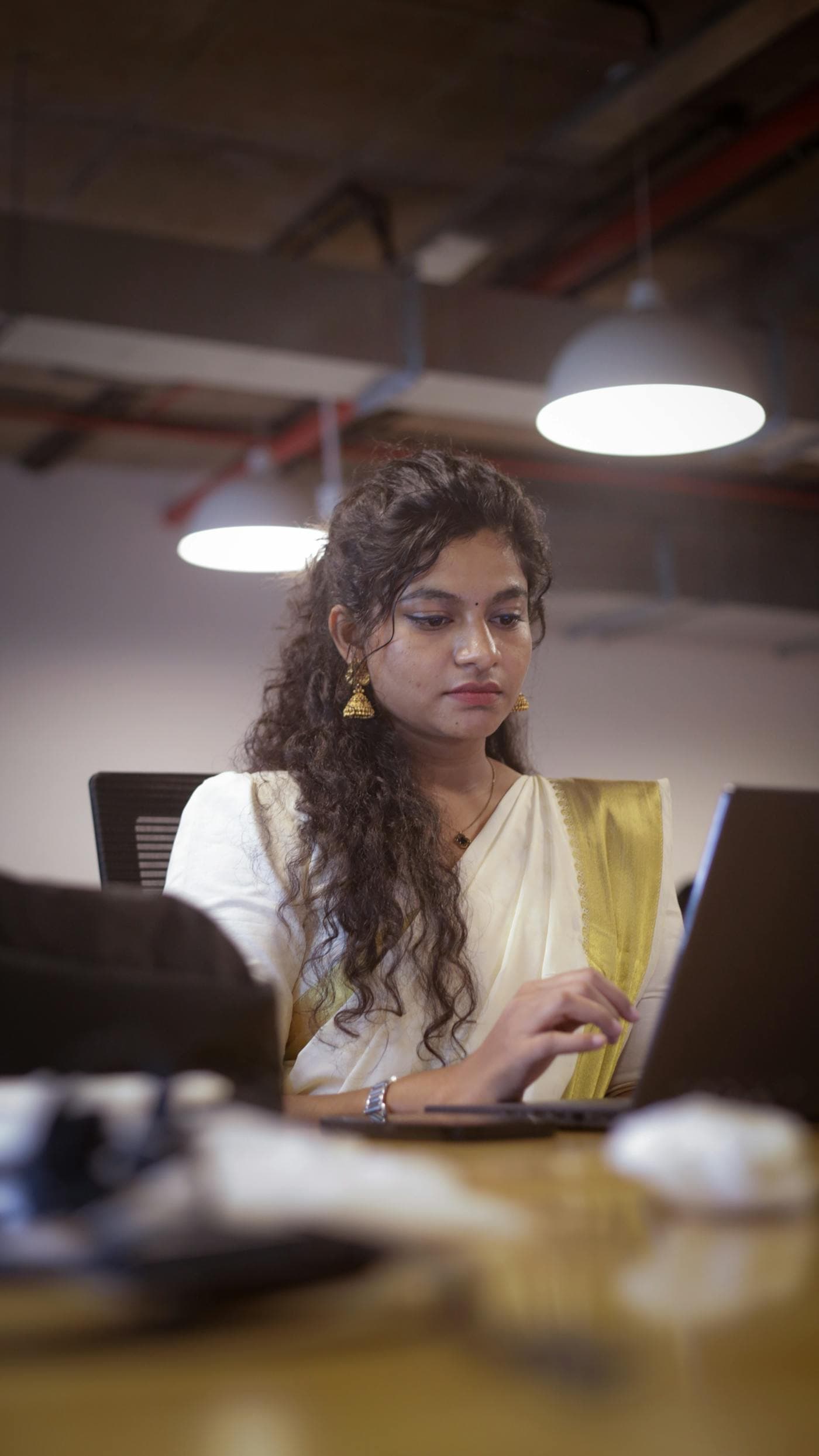Professional business executive reviewing technology requirements on a laptop